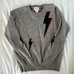 For the republic sweater with pink lightening bolts